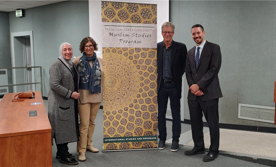 Muslim Studies director Mohammad Khalil poses with attendees at Kerr lecture 